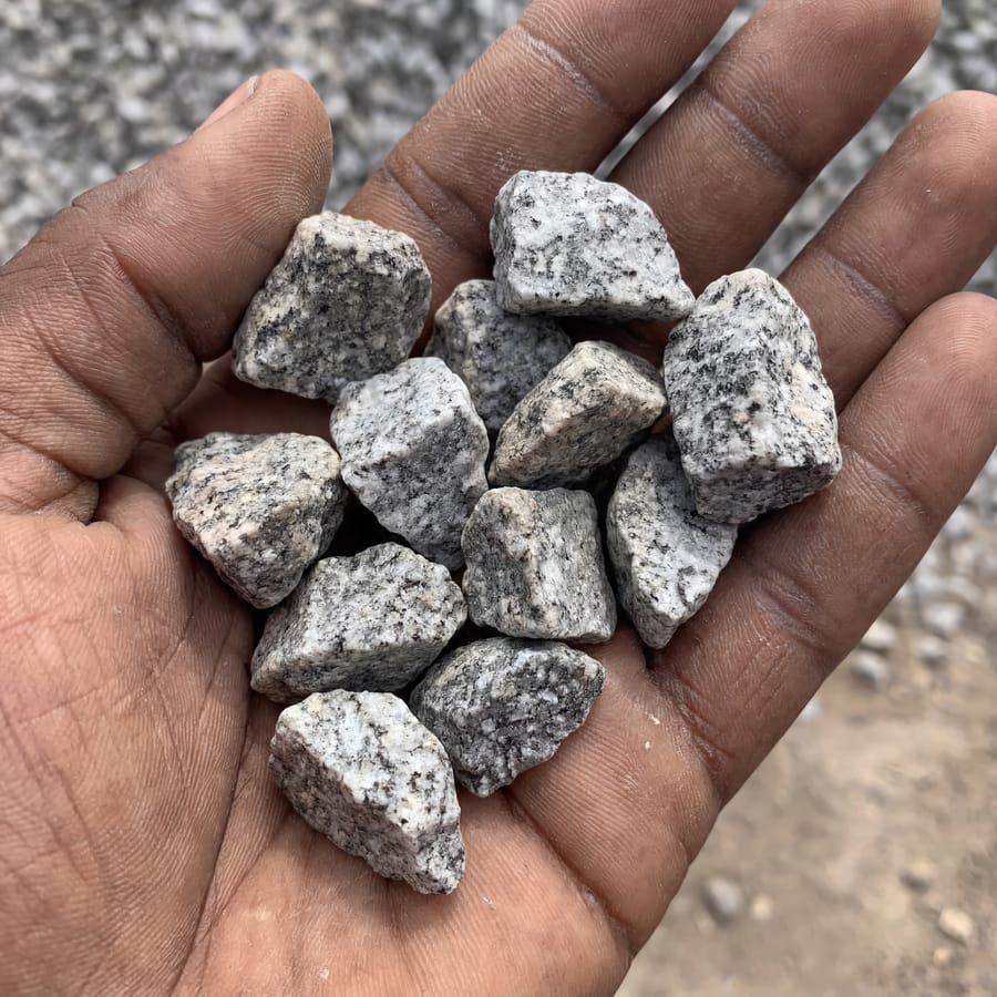 Chippings ¾" texture close-up, hand for scale